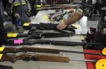 Dealer displays firearms for sale at a gun show in Kansas City